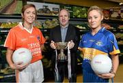 24 January 2014; Pictured at the launch of the 2014 TESCO Homegrown Ladies National Football League is Tipperary Ladies football manager John Leahy with Caroline O'Hanlon, left, Armagh, and Samantha Lambert, Tipperary. The League gets underway on Sunday February 2nd with 30 counties competing in 4 Divisions. There are 7 rounds with the top 4 teams in each division proceeding to the semi finals and the bottom team being relegated. The Division 1,2 and 3 finals take place in Parnell Park on May 10th and will be televised live on TG4. Tesco, Clarehall, Dublin. Picture credit: David Maher / SPORTSFILE