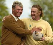 20 May 2005; Darren Clarke, left, is congratulated by Miguel Angel Jimenez on the 18th green after his eagle putt during the second round of the  Nissan Irish Open Golf Championship. Carton House Golf Club, Maynooth, Co. Kildare. Picture credit; Matt Browne / SPORTSFILE