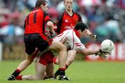 22 May 2005; Ryan Mellon, Tyrone, in action against Ambrose Rogers, Down. Bank of Ireland Ulster Senior Football Championship, Tyrone v Down, Healy Park, Omagh, Co. Tyrone. Picture credit; David Maher / SPORTSFILE