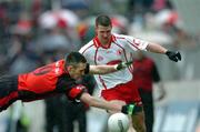 22 May 2005; Colin Holmes, Tyrone, in action against Dan Gordon, Down. Bank of Ireland Ulster Senior Football Championship, Tyrone v Down, Healy Park, Omagh, Co. Tyrone. Picture credit; David Maher / SPORTSFILE