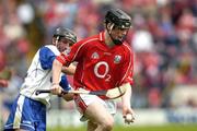22 May 2005; Shane O'Neill, Cork, prepares to clear under pressure from John Wall, Waterford. Munster Intermediate Hurling Championship, Cork v Waterford, Semple Stadium, Thurles, Co. Tipperary. Picture credit; Ray McManus / SPORTSFILE