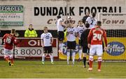 24 January 2014; Barnsley's Thomas Cywka, left, sends the ball over the Dundalk wall to score his side's first goal of the match. Pre-Season Friendly, Dundalk v Barnsley, Oriel Park, Dundalk, Co. Louth. Photo by Sportsfile