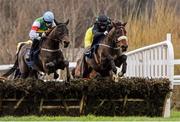 25 January 2014; Eventual winner Back Before Dawn, with Bryan Cooper up, left, leads Painted Lady, with Paddy Kennedy up, on their way to winning the leopardstown.com Mares Maiden Hurdle. Leopardstown Racecourse, Leopardstown, Co. Dublin. Picture credit: Ramsey Cardy / SPORTSFILE