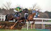25 January 2014; Flaxen Flare, with D.J O'Leary up, right, leads eventual winner Gilgamboa, with Mark Walsh up, over the last during the Boylesports.com Hurdle. Leopardstown Racecourse, Leopardstown, Co. Dublin. Picture credit: Ramsey Cardy / SPORTSFILE