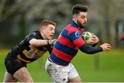25 January 2014; Michael McGrath, Clontarf, is tackled by Derry O'Connor, Young Munster. Ulster Bank League, Division 1A, Young Munster v Clontarf, Tom Clifford Park, Limerick. Picture credit: Diarmuid Greene / SPORTSFILE