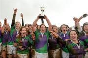 25 January 2014; CYM team captain Diane Mcllhagga lifts the cup as her team-mates celebrate after winning the Leinster Women's Division 4 League Final. Leinster Rugby Women's Finals Day, Edenderry RFC, Edenderry, Co. Offaly. Picture credit: Matt Browne / SPORTSFILE