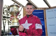 26 January 2014; Jockey Byan Cooper with the winning trophy after he rode Trifolium to victory in The Frank Ward Solicitors Arkle Novice Steeplechase. Leopardstown Racecourse, Leopardstown, Co. Dublin. Picture credit: Barry Cregg / SPORTSFILE
