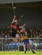 26 January 2014; Patrick Deasy, UCC, in action against Seadna Morey, Clare. Waterford Crystal Cup Semi-Final, Clare v University College Cork. Sixmilebridge, Co. Clare. Picture credit: Diarmuid Greene / SPORTSFILE