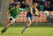 26 January 2014; Craig Burns, Roscommon, in action against Damien Moran, Leitrim. FBD League, Final, Leitrim v Roscommon. Páirc Sean Mac Diarmada, Carrick on Shannon, Co. Leitrim. Picture credit: David Maher / SPORTSFILE