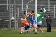 26 January 2014; John Mulligan, Leitrim, beats Roscommon's Niall Carty and goalkeeper Darren O'Malley to score his side's second goal. FBD League, Final, Leitrim v Roscommon. Páirc Sean Mac Diarmada, Carrick on Shannon, Co. Leitrim. Picture credit: David Maher / SPORTSFILE