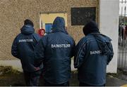 26 January 2014; Members of the Clare management team, from left to right, Fergal Lynch, Louis Mulqueen, and Davy Fitzgerald, all wearing jackets branded with the word 'Bainisteoir', make their way into the ground before the game. Waterford Crystal Cup Semi-Final, Clare v University College Cork. Sixmilebridge, Co. Clare. Picture credit: Diarmuid Greene / SPORTSFILE