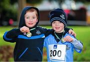 26 January 2014; James McNamee and Jamie Flynn, both aged six, from Portmarnock A.C., Co. Dublin, after completing the fun run during the 2014  Raheny 5 mile road race. St. Anne's Park, Raheny, Dublin. Picture credit: Tomás Greally / SPORTSFILE