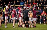 26 January 2014; Kilkenny's Eoin Larkin is attended to as referee Brian Gavin issues a red card to Galway's Darragh Burke late in the game. Bord Na Mona Walsh Cup, Semi-Final, Kilkenny v Galway, St. Lachtain's GAA Club, Freshford, Co. Kilkenny. Picture credit: Ray McManus / SPORTSFILE