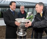 27 January 2014; Minister for Transport, Tourism and Sport Leo Varadkar T.D, alongside FAI Chief Executive John Delaney, hands the Sam Maguire Cup back to Dublin County Board CEO John Costello during the official opening of the multi-sport all weather pitches at the National Sports Campus, Blanchardstown, Dublin. Picture credit: David Maher / SPORTSFILE