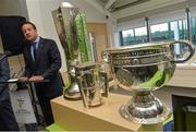 27 January 2014; Minister for Transport, Tourism and Sport Leo Varadkar T.D, alongside the FAI Airtricity League Trophy, the Liam MacCarthy Cup and the Sam Maguire Cup, during the official opening of the multi-sport all weather pitches at the National Sports Campus, Blanchardstown, Dublin. Picture credit: David Maher / SPORTSFILE