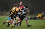 28 January 2014; Daniel Ward, Cistercian College, is tackled by Evan Gordan, left, and Finn Searle, St. Patrick's Classical School. Fr. Godfrey Cup, Semi-Final, Cistercian College v St. Patrick's Classical School, Newbridge College, Newbridge, Co. Kildare. Picture credit: Barry Cregg / SPORTSFILE