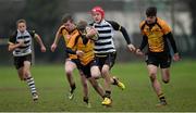 28 January 2014; Evan Browne, Cistercian College, breaks away from Jack Parkes, extreme left, Finn Searle, left, and Keelan McKeever, St. Patrick's Classical School. Fr. Godfrey Cup, Semi-Final, Cistercian College v St. Patrick's Classical School, Newbridge College, Newbridge, Co. Kildare. Picture credit: Barry Cregg / SPORTSFILE