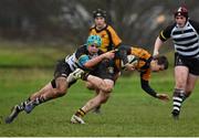 28 January 2014; Conor Brennan, St. Patrick's Classical School, is tackled by Tom Byrne, Cistercian College. Fr. Godfrey Cup, Semi-Final, Cistercian College v St. Patrick's Classical School, Newbridge College, Newbridge, Co. Kildare. Picture credit: Barry Cregg / SPORTSFILE