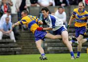 29 May 2005; Rory Donnelly, Clare, in action against Paul  Ogle, Waterford. Bank of Ireland Munster Senior Football Championship, Clare v Waterford, Cusack Park, Ennis, Co. Clare. Picture credit; Kieran Clancy / SPORTSFILE