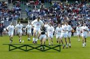 29 May 2005; Kildare captain John Doyle jumps the team bench as the players make their way over for the team photograph. Bank of Ireland Leinster Senior Football Championship, Kildare v Westmeath, Croke Park, Dublin. Picture credit; Pat Murphy / SPORTSFILE