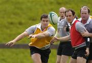 31 May 2005; Flanker David Wallace throws out a pass watched by Johnny O'Connor, Girvan Dempsey and Frank Sheahan during Ireland rugby squad training. University of Limerick, Limerick. Picture credit; Brendan Moran / SPORTSFILE
