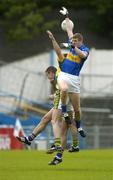 29 May 2005; Fergal O'Callaghan, Tipperary, contests a high ball with team-mate Kevin Mulryan, hidden, and William Kirby, Kerry. Bank of Ireland Munster Senior Football Championship, Tipperary v Kerry, Semple Stadium, Thurles, Co. Tipperary. Picture credit; Brendan Moran / SPORTSFILE