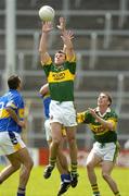 29 May 2005; William Kirby, Kerry, supported by team-mate Marc O Se, fields a high ball ahead of Fergal O'Callaghan (9) and Glen Burke, Tipperary. Bank of Ireland Munster Senior Football Championship, Tipperary v Kerry, Semple Stadium, Thurles, Co. Tipperary. Picture credit; Brendan Moran / SPORTSFILE