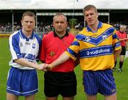 29 May 2005; Waterford captain Trevor Costelloe and Clare captain Ger Quinlan shake hands in front of referee Pat McGovern before the game. Bank of Ireland Munster Senior Football Championship, Clare v Waterford, Cusack Park, Ennis, Co. Clare. Picture credit; Kieran Clancy / SPORTSFILE