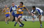 29 May 2005; Mark O'Connell, Clare, in action against Shane Briggs, left, and Andrew Heffernan, Waterford. Bank of Ireland Munster Senior Football Championship, Clare v Waterford, Cusack Park, Ennis, Co. Clare. Picture credit; Kieran Clancy / SPORTSFILE