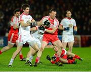 1 February 2014; Patsy Bradley, Derry, in action against Conan Grugan, Tyrone. Allianz Football League Division 1 Round 1, Derry v Tyrone, Celtic Park, Derry. Picture credit: Oliver McVeigh / SPORTSFILE