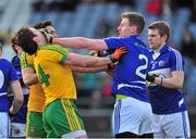 2 February 2014; Denis Booth, Laois, strikes Michael Murphy, Donegal after he protested his challenge on team-mate Mark McHugh. Allianz Football League, Division 2, Round 1, Laois v Donegal, O'Moore Park, Portlaoise, Co. Laois. Picture credit: Barry Cregg / SPORTSFILE