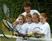 30 May 2005; Owen Casey with stars of the future l to r; Lucy McEvoy, Megan Barton, Sally-Ann Appelby and Julia O'Connell pictured at the announcement that SPAR is to sponsor this year's Irish National Tennis Championships at Donnybrook Lawn Tennis Club. This picture is taken at Donnybrook Lawn Tennis Club, Dublin. Picture credit; Ray McManus / SPORTSFILE