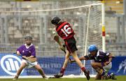 30 May 2005; Alan O'Connell, Scoil Colmcille, scores a goal despite the efforts of Kevin Garry and goalkeeper Patrick Tighe, St Laurence's B.N.S Kilmacud. Allianz Cumann na mBunscol Hurling Finals, Corn Herald, Scoil Colmcille, Knocklyon v St. Laurence's B.NS, Kilmacud, Croke Park, Dublin. Picture credit; Damien Eagers / SPORTSFILE