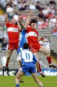 5 June 2005; Derry's Patsy Bradley, left, supported by team-mate Eoin Bradley contest a high ball with Monaghan's Eoin Lennon and Paul Finlay, 11. Bank of Ireland Ulster Senior Football Championship, Monaghan v Derry, St. Tighernach's Park, Clones, Co. Monaghan. Picture credit; Damien Eagers / SPORTSFILE