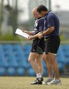8 June 2005; Scrum-half Peter Stringer, left, checks notes with assistant coach Michael Bradley during training. Ireland rugby squad training, Kintetsu Hanazono rugby ground, Osaka, Japan. Picture credit; Brendan Moran / SPORTSFILE