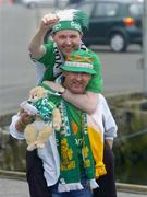 8 June 2005; Republic of Ireland supporter Jimmy Dunne gives a lift to his brother Brian, both from Ballymun, in advance of the FIFA 2006 World Cup Qualifier game against the Faroe Islands. Torshavn, Faroe Islands. Picture credit; Damien Eagers / SPORTSFILE