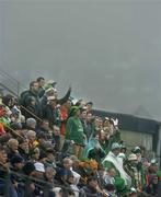 8 June 2005; Republic of Ireland supporters cheer on their team in the midst of the fog and rain. FIFA 2006 World Cup Qualifier, Faroe Islands v Republic of Ireland, Torsvollur Stadium, Torshavn, Faroe Islands. Picture credit; David Maher / SPORTSFILE