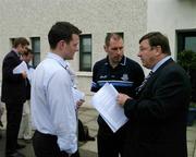 8 June 2005; Dublin's Tomas McGrane, left, and Carl Meehan, vice-captain, in conversation with delegate Kevin Drumgoole, right, when members of the Dublin hurling squad, who handed out copies of a letter they delivered to a meeting of the Dublin County Board at their offices in Parnell Park, Dublin. Picture credit; Ray McManus/ SPORTSFILE