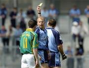 5 June 2005; Referee John Bannon, hidden, issues Dublin's Ciaran Whealan, partially hidden, with a yellow card in the first minute of the game. Bank of Ireland Leinster Senior Football Championship, Dublin v Meath, Croke Park, Dublin. Picture credit; David Maher / SPORTSFILE