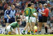 5 June 2005; Referee John Bannon prepares to issue Dublin's Ciaran Whealan with a yellow card in the first minute of the game as Meath's Nigel Crawford picks himself up off the ground. Bank of Ireland Leinster Senior Football Championship, Dublin v Meath, Croke Park, Dublin. Picture credit; David Maher / SPORTSFILE