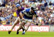 12 June 2005; Packie Cuddy, Laois, in action against Michael Jordan, Wexford. Guinness Leinster Senior Hurling Championship Semi-Final, Wexford v Laois, Croke Park, Dublin. Picture credit; Pat Murphy / SPORTSFILE