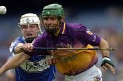 12 June 2005; Keith Rossiter, Wexford, is tackled by Tommy Fitzgerald, Laois. Guinness Leinster Senior Hurling Championship Semi-Final, Wexford v Laois, Croke Park, Dublin. Picture credit; Matt Browne / SPORTSFILE