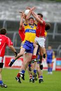 12 June 2005; Noel Kennedy, Clare, in action against Noel O'Riordan and Alan O'Connor, Cork. Munster Junior Football Championship Semi-Final, Clare v Cork, Cusack Park, Ennis, Co. Clare. Picture credit; Kieran Clancy / SPORTSFILE