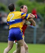 12 June 2005; Enda Malone, Clare, in action against Vincent Hurley, Cork. Munster Junior Football Championship Semi-Final, Clare v Cork, Cusack Park, Ennis, Co. Clare. Picture credit; Kieran Clancy / SPORTSFILE