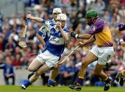 12 June 2005; Tommy Fitzgerald, Laois, is tackled by Keith Rossiter, Wexford. Guinness Leinster Senior Hurling Championship Semi-Final, Wexford v Laois, Croke Park, Dublin. Picture credit; Matt Browne / SPORTSFILE