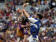 12 June 2005; Redmond Barry, Wexford, in action against Packie Cuddy, Laois. Guinness Leinster Senior Hurling Championship Semi-Final, Wexford v Laois, Croke Park, Dublin. Picture credit; Pat Murphy / SPORTSFILE