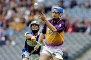 12 June 2005; David O'Connor, Wexford, is tackled by Damien Culleton, Laois. Guinness Leinster Senior Hurling Championship Semi-Final, Wexford v Laois, Croke Park, Dublin. Picture credit; Matt Browne / SPORTSFILE