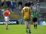 12 June 2005; Referee Joe McQuillan issues the red card to Donegal's Kevin Cassidy, not in picture. Bank of Ireland Ulster Senior Football Championship Semi-Final, Donegal v Armagh, St. Tighernach's Park, Clones, Co. Monaghan. Picture credit; Damien Eagers / SPORTSFILE