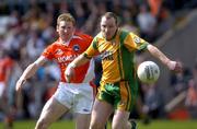 12 June 2005; Adrian Sweeney, Donegal, in action against Francie Bellew, Armagh. Bank of Ireland Ulster Senior Football Championship Semi-Final, Donegal v Armagh, St. Tighernach's Park, Clones, Co. Monaghan. Picture credit; Damien Eagers / SPORTSFILE