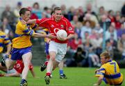 12 June 2005; James Masters, Cork, in action against Kevin Dilleen, Clare. Bank of Ireland Munster Senior Football Championship Semi-Final, Clare v Cork, Cusack Park, Ennis, Co. Clare. Picture credit; Kieran Clancy / SPORTSFILE